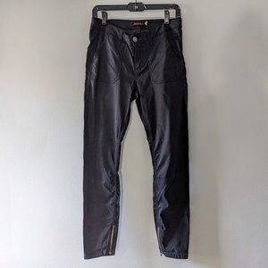 Gramicci women's black pants with flap back pockets and zippers on the bottom.